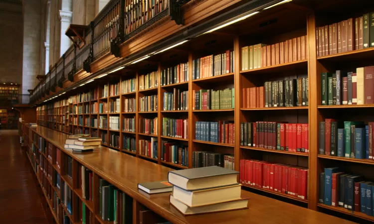 Long shelves full of books in a library